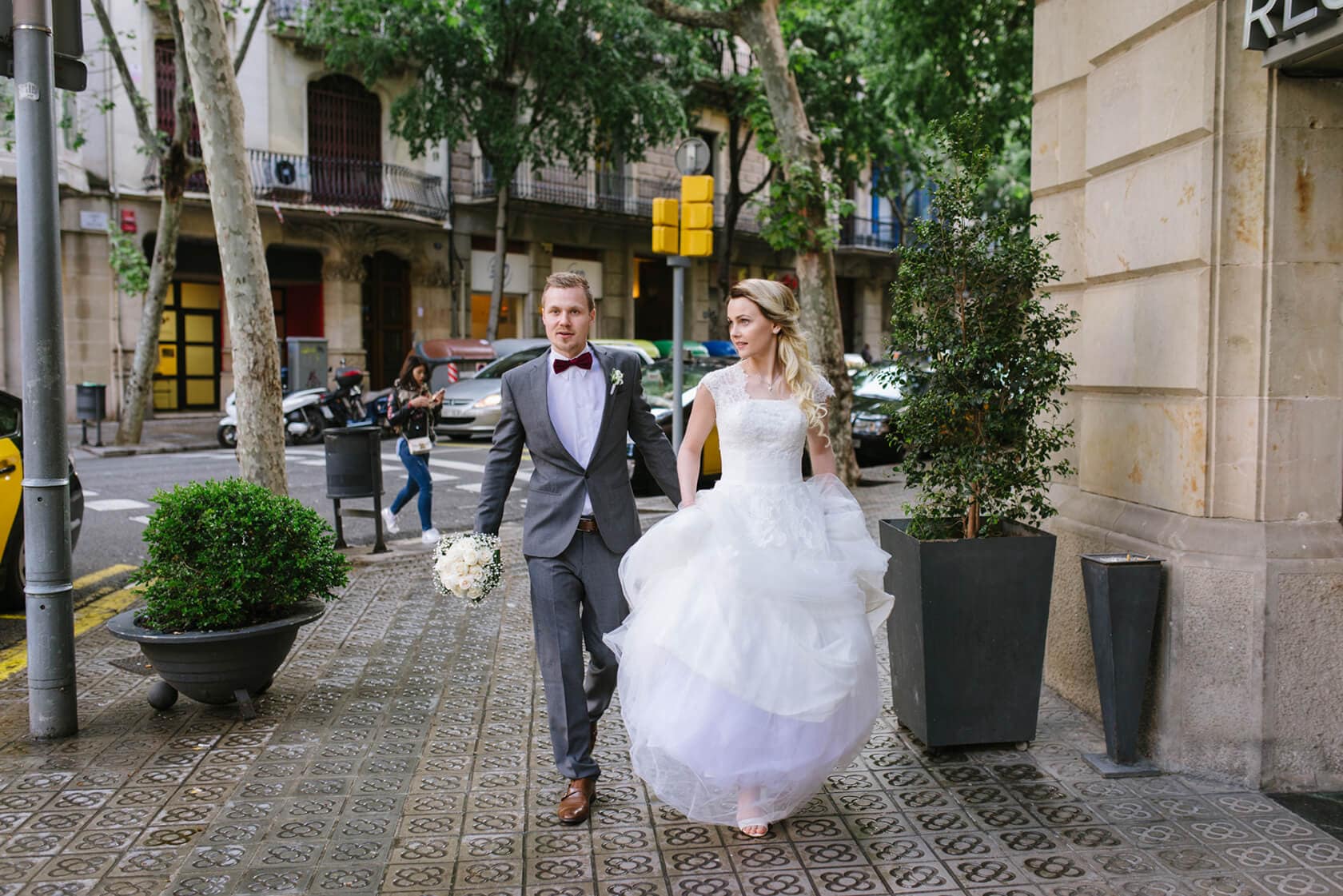 Bride and groom walking on Barcelona street, Barcelona wedding photographer - Barcelona Wedding Photographer