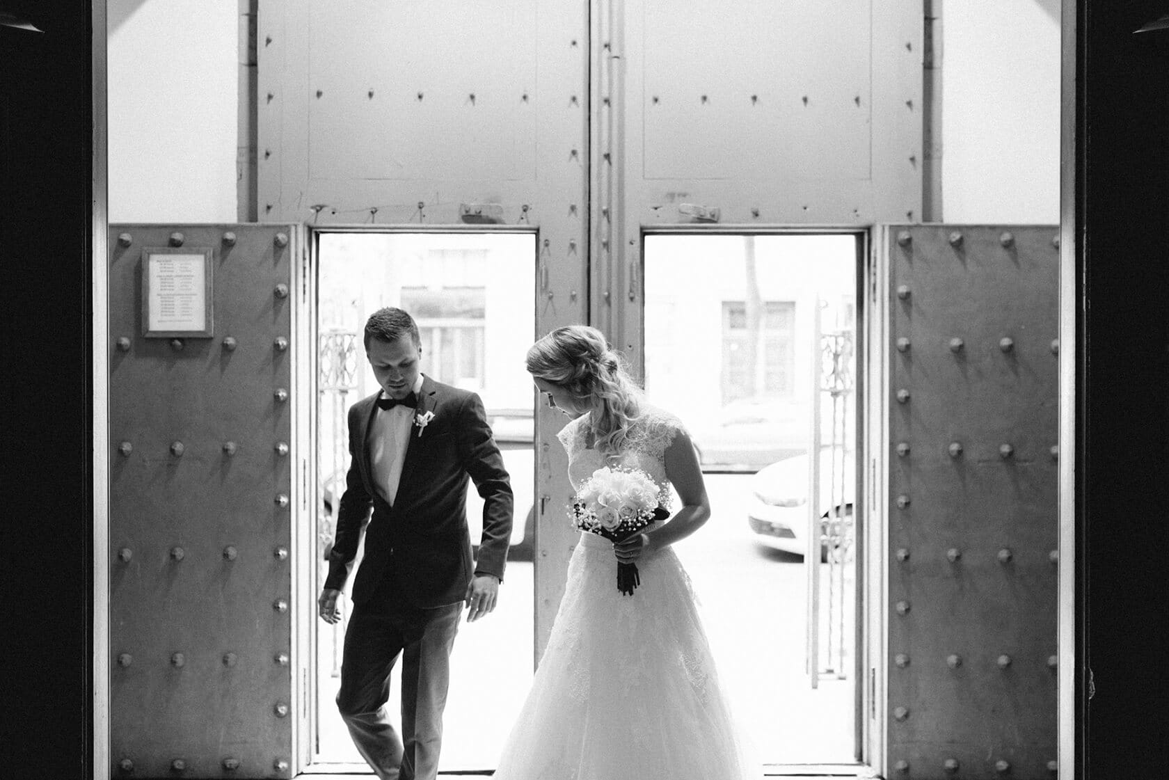 Bride and groom exiting church doors, Barcelona wedding photographer - Barcelona Wedding Photographer