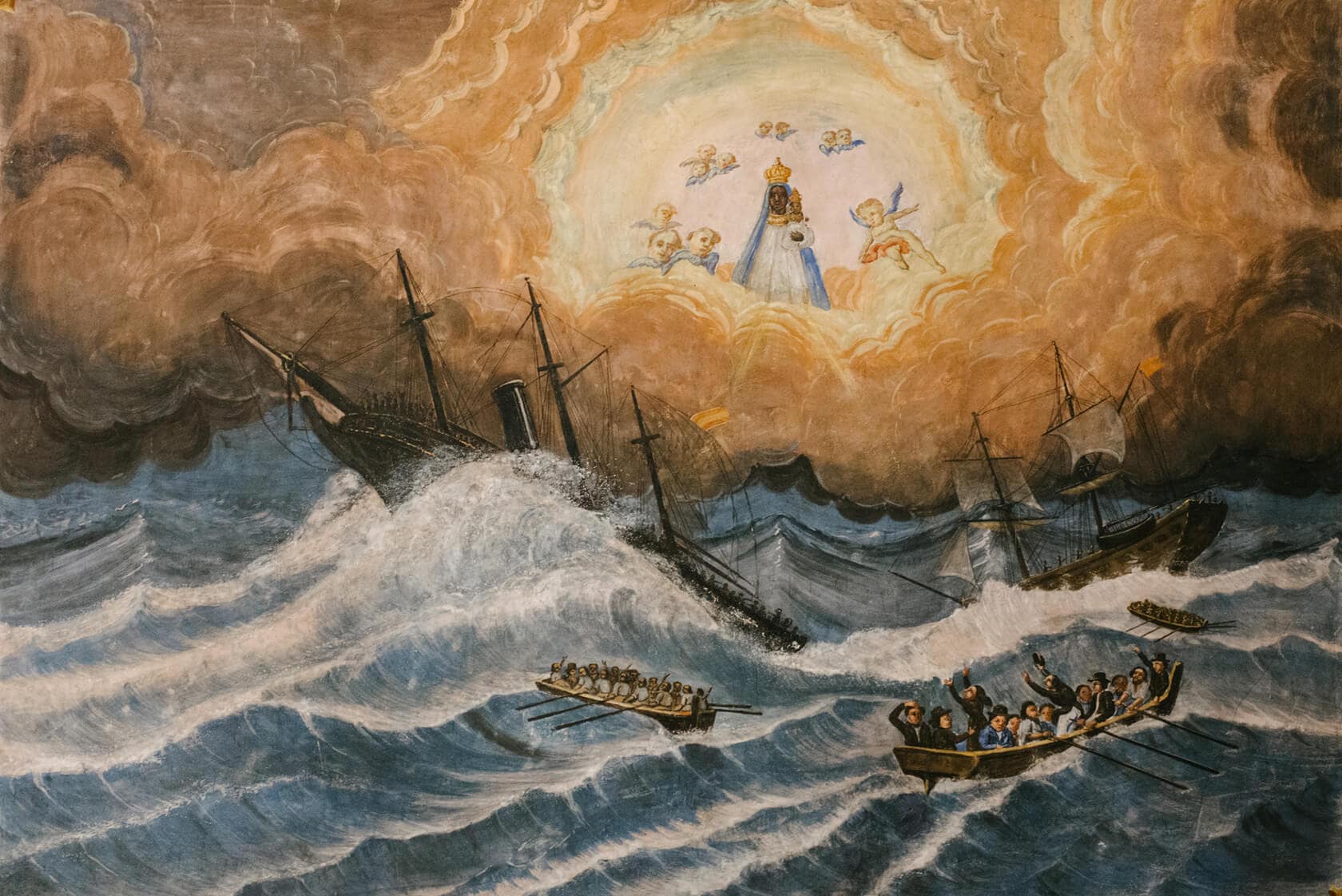 Painting of ships in a storm with a divine vision of Mary and cherubs above. - Barcelona Wedding Photographer