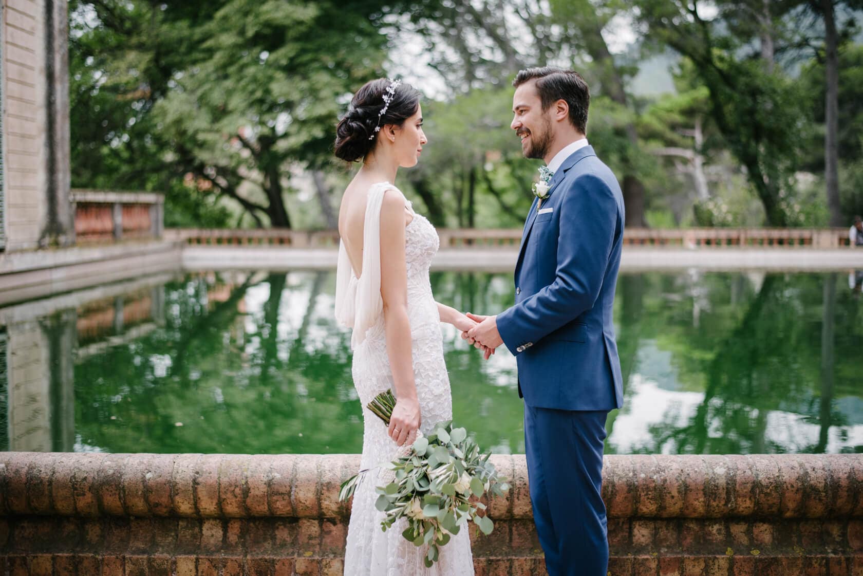 Wedding at Parc del Laberint d'Horta: Bride and groom holding hands - Barcelona Wedding Photographer