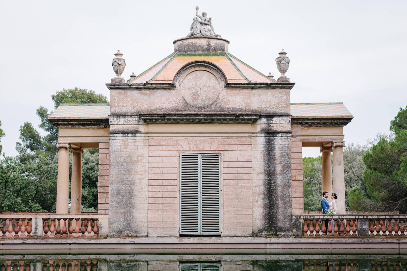 Wedding couple on balcony of historic building at Parc del Laberint d'Horta - Barcelona Wedding Photographer