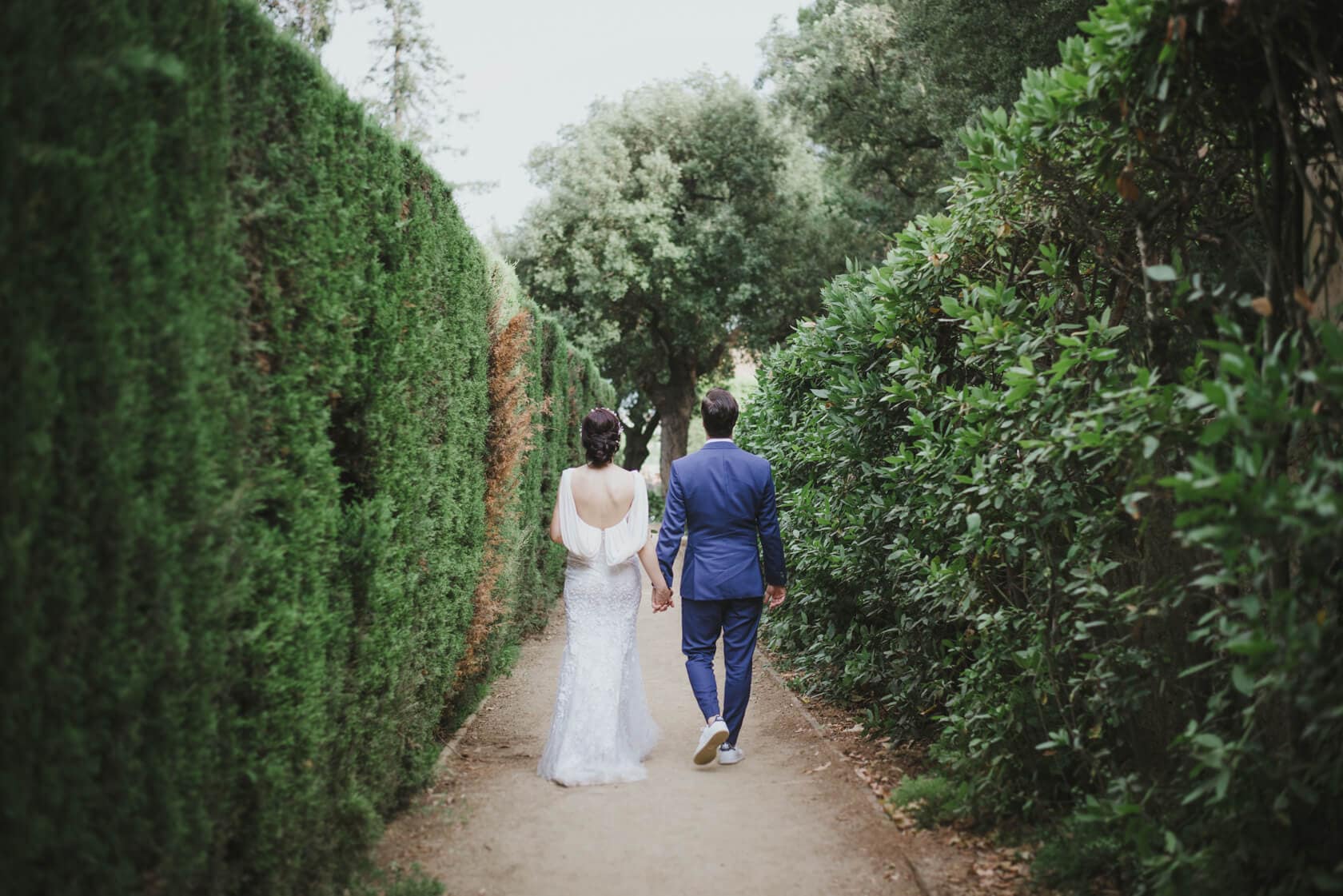 Wedding couple walking in Parc del Laberint d'Horta garden - Barcelona Wedding Photographer