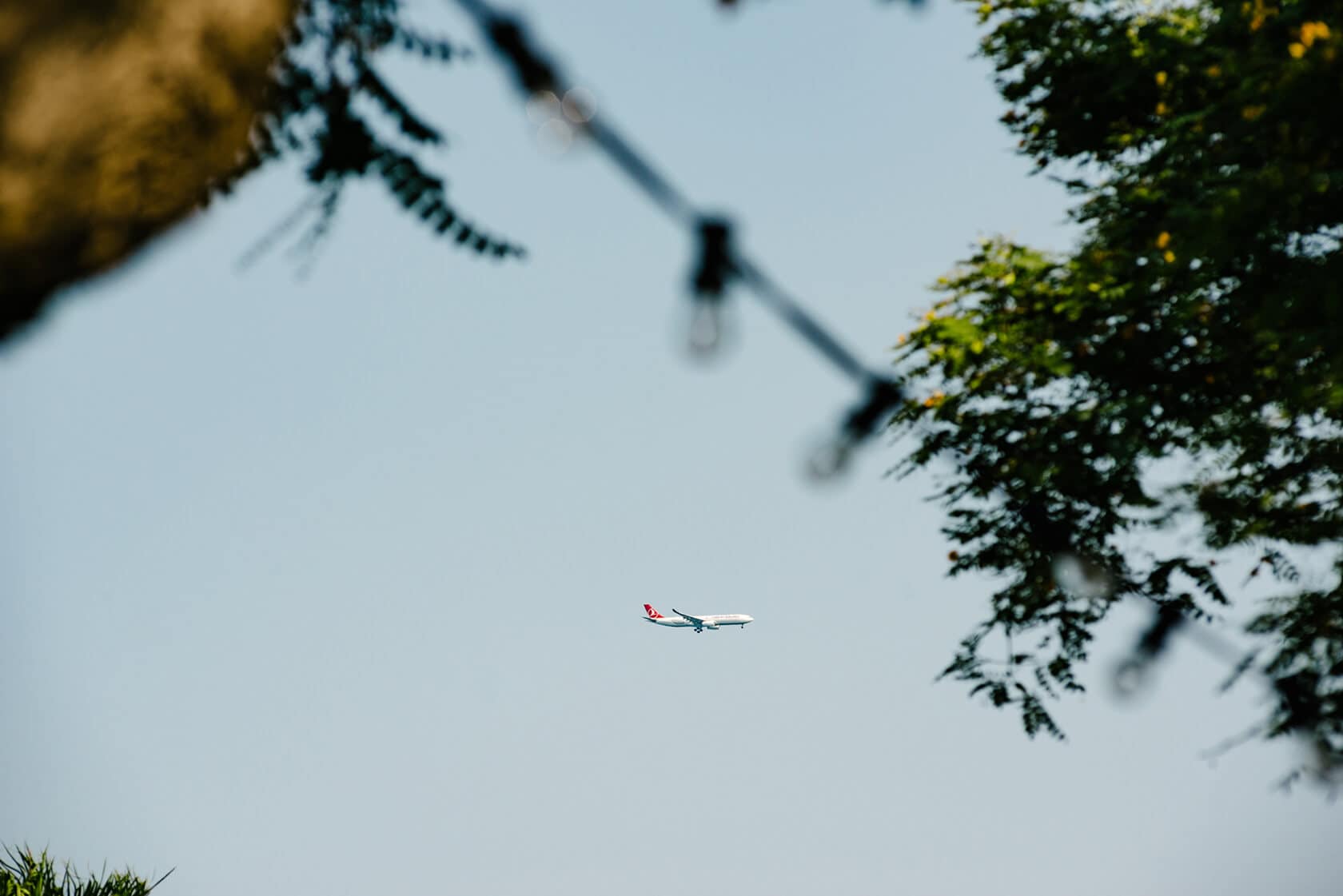 Airplane flying over Hotel Miramar Barcelona wedding venue - Barcelona Wedding Photographer