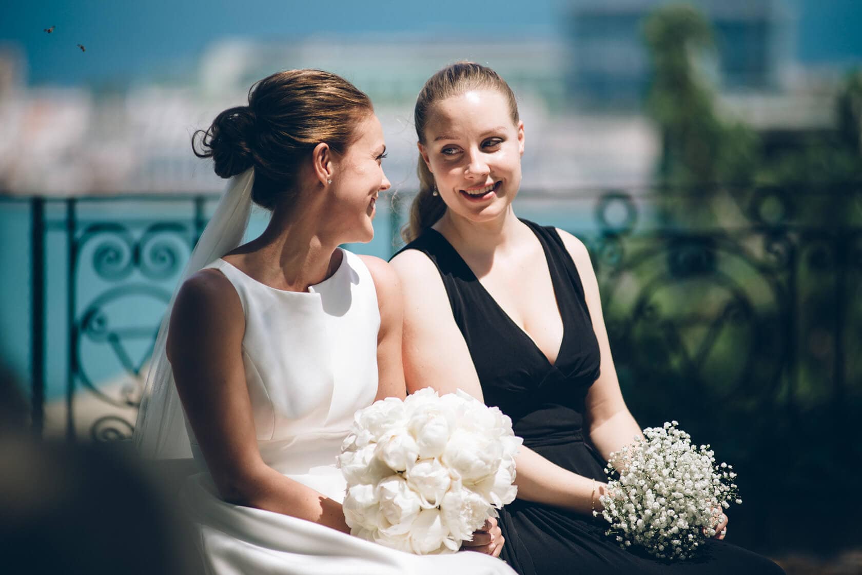 Bride and bridesmaid with bouquets at Hotel Miramar Barcelona wedding - Barcelona Wedding Photographer