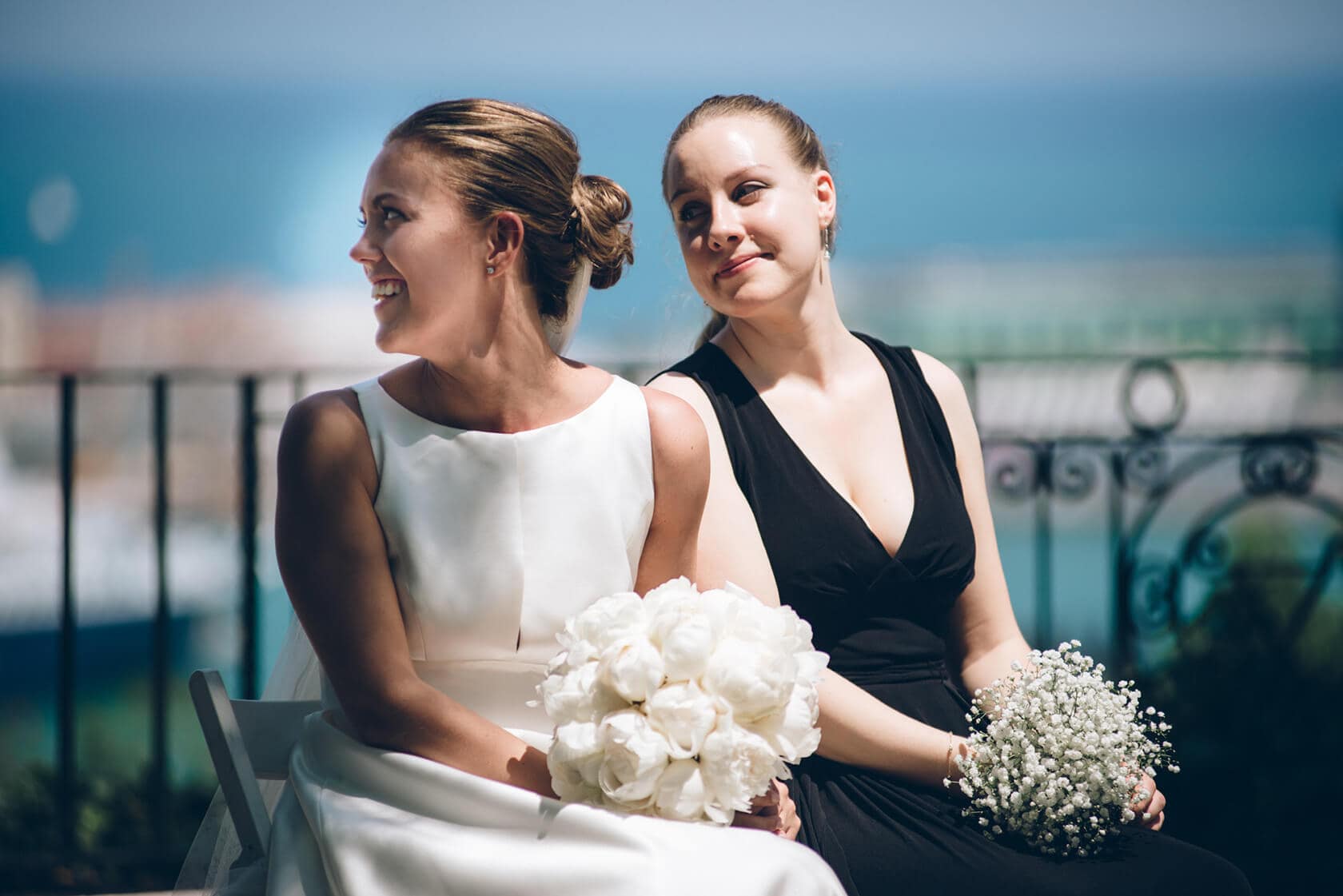 Bride and bridesmaid with bouquets at Hotel Miramar Barcelona wedding - Barcelona Wedding Photographer