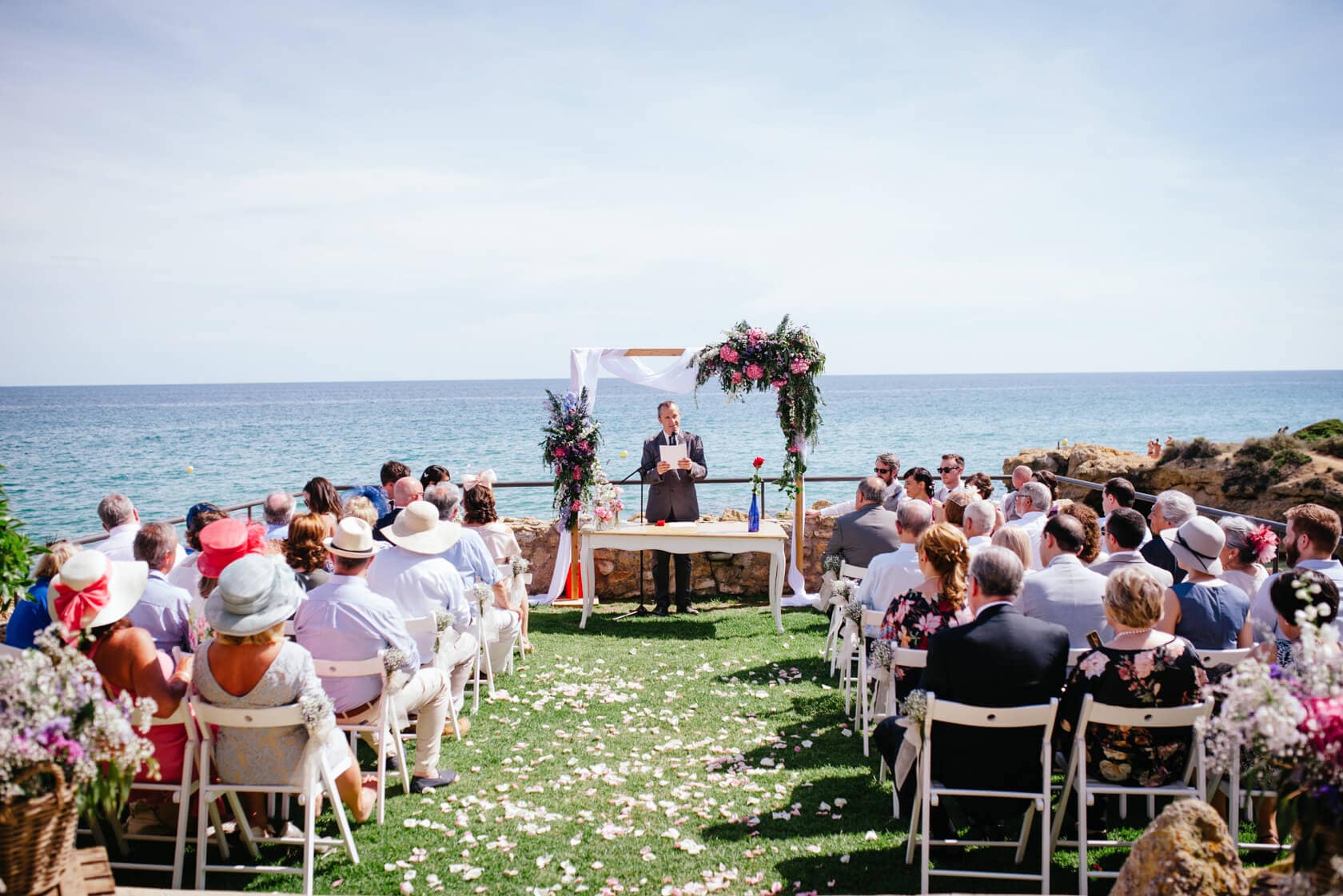 Outdoor wedding ceremony at a Barcelona wedding venue with ocean view - Barcelona Wedding Photographer