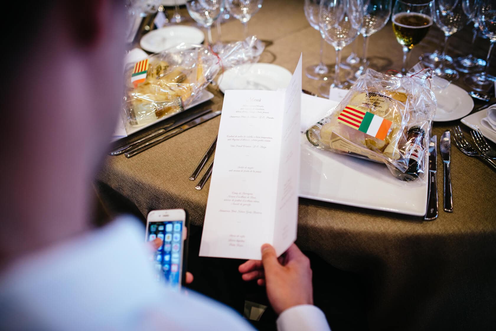 Wedding menu at Castell de Tamarit, Sitges, with Italian and Irish flags on food. - Barcelona Wedding Photographer