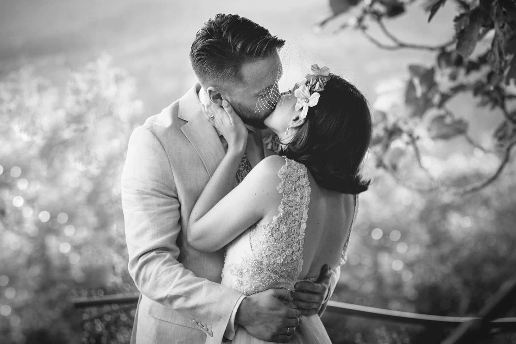 Bride and groom kissing at a vintage style wedding - Barcelona Wedding Photographer