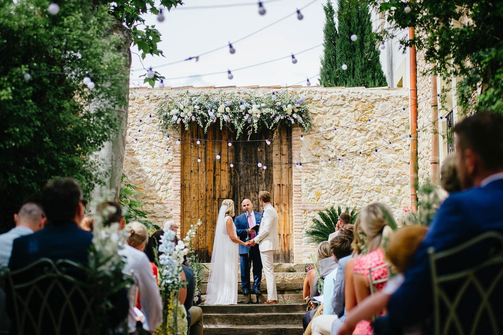 Wedding ceremony at Casa Felix wedding venue with couple exchanging vows. - Barcelona Wedding Photographer