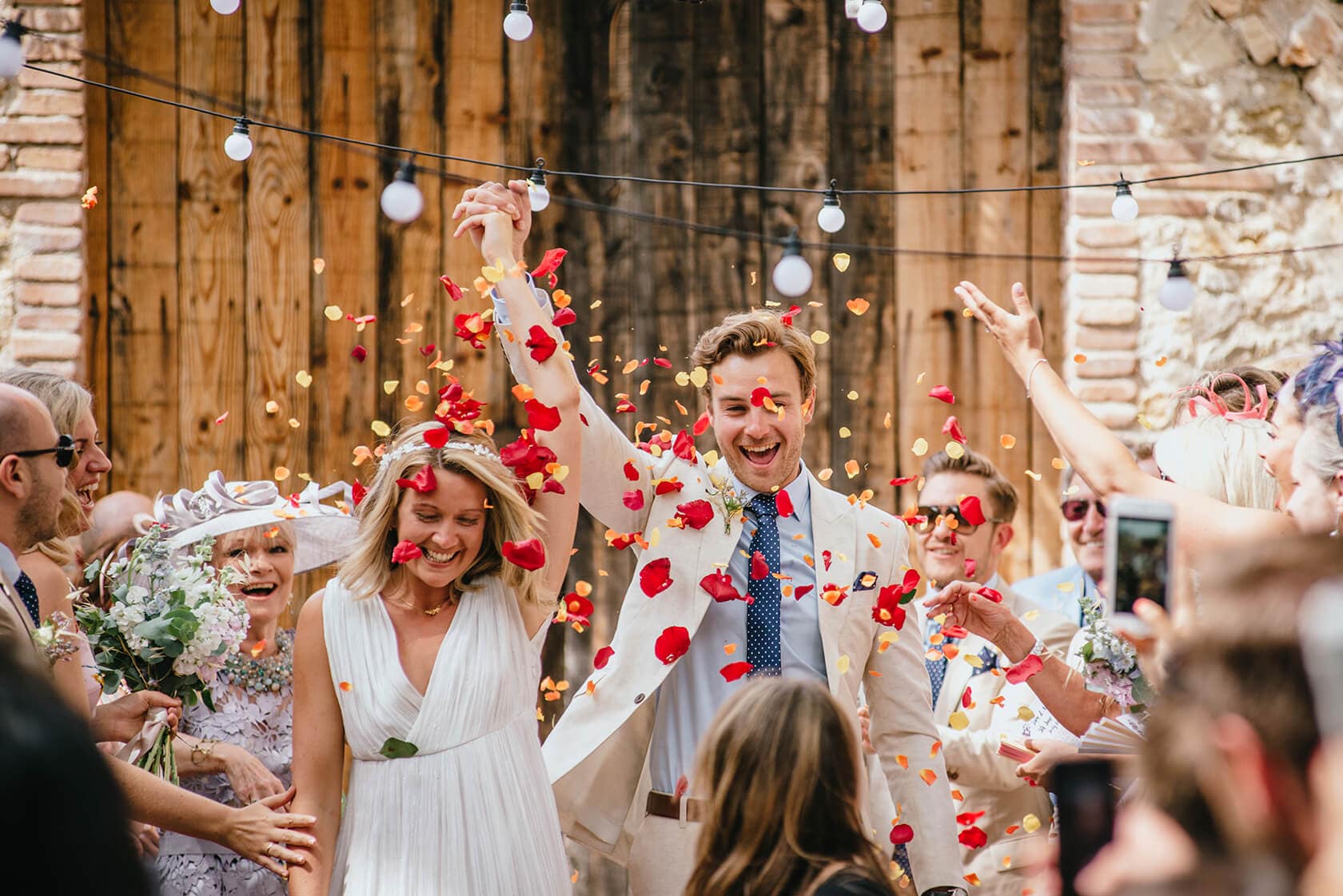 Newlyweds showered with petals at Casa Felix wedding venue. - Barcelona Wedding Photographer