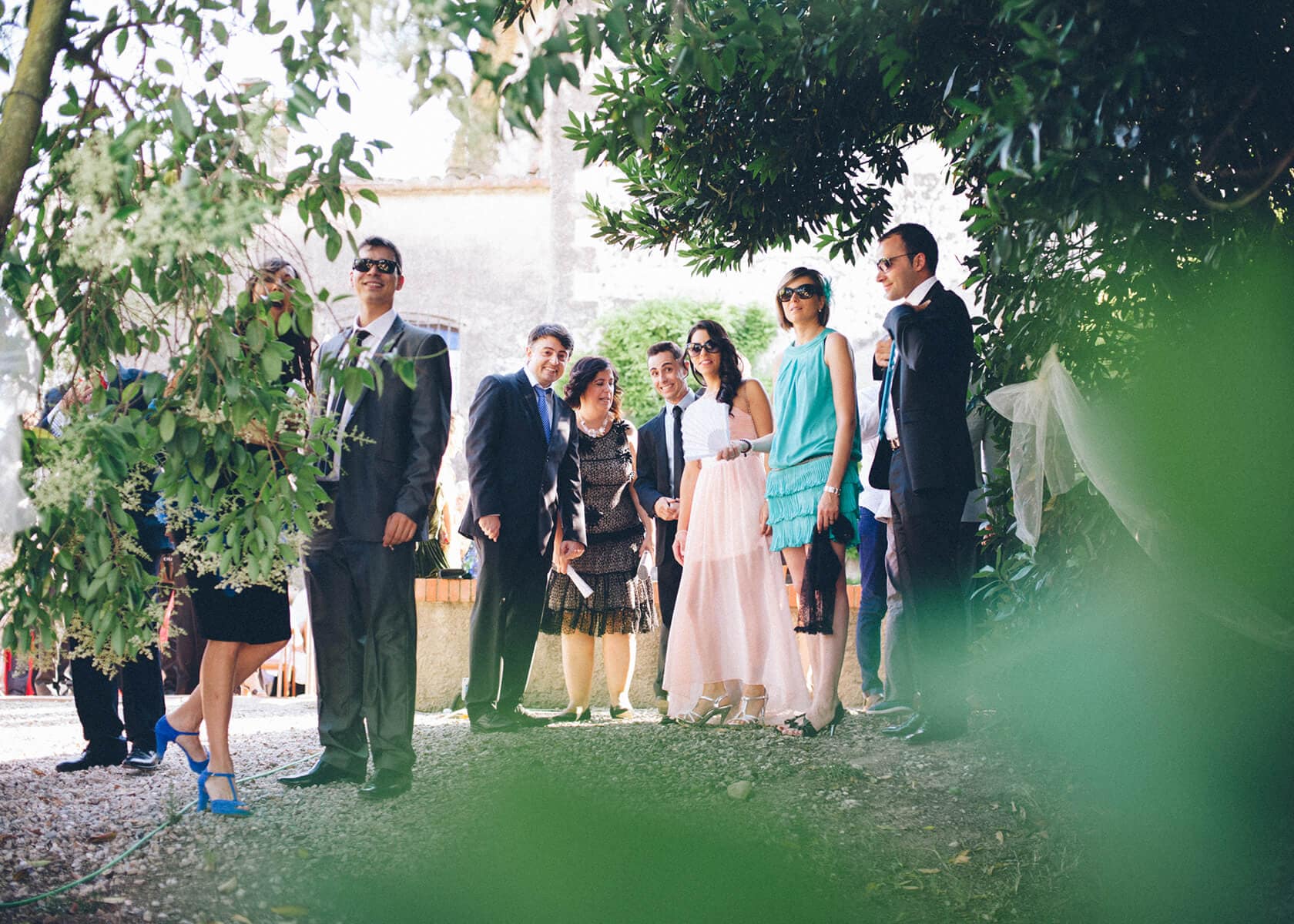 Wedding guests in casual attire gathered outdoors, Barcelona wedding photographer - Barcelona Wedding Photographer