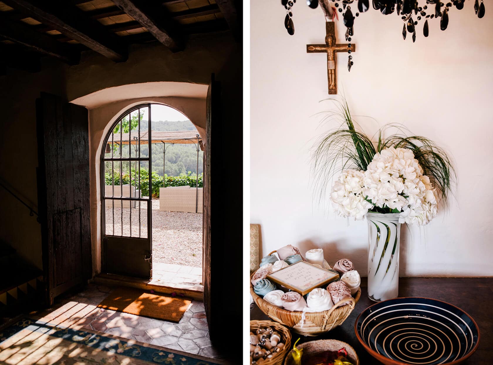 Torre del Veguer wedding: Rustic doorway with archway and courtyard view, and a vase of white hydrangeas. - Barcelona Wedding Photographer