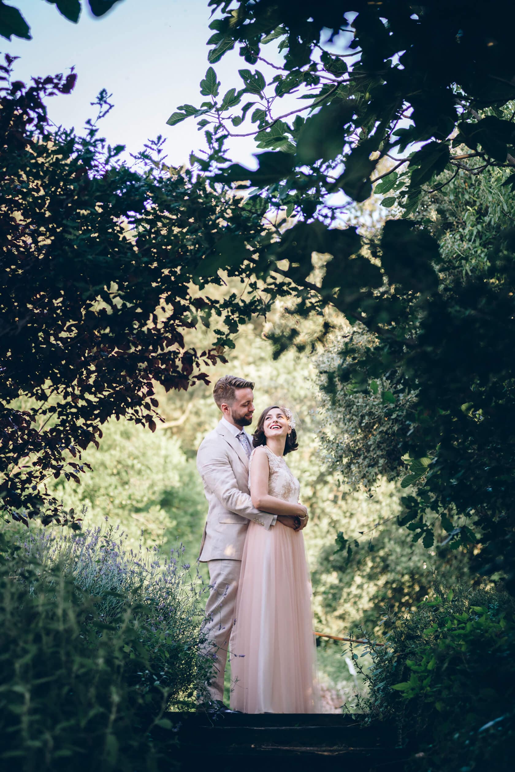 Couple in vintage style wedding attire embracing outdoors - Barcelona Wedding Photographer