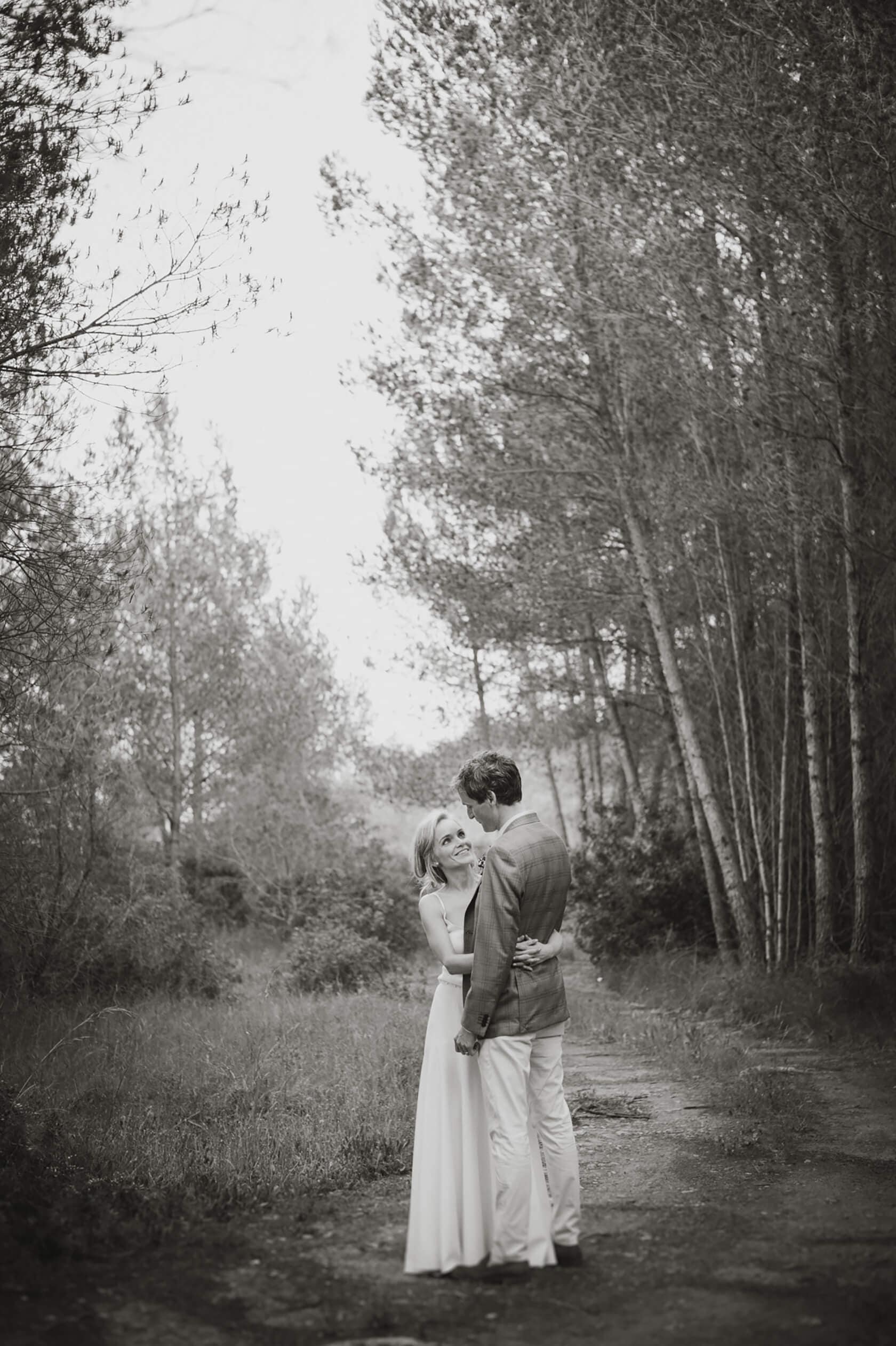 Bride and groom embrace on a path at Casanova Estate wedding venue. - Barcelona Wedding Photographer