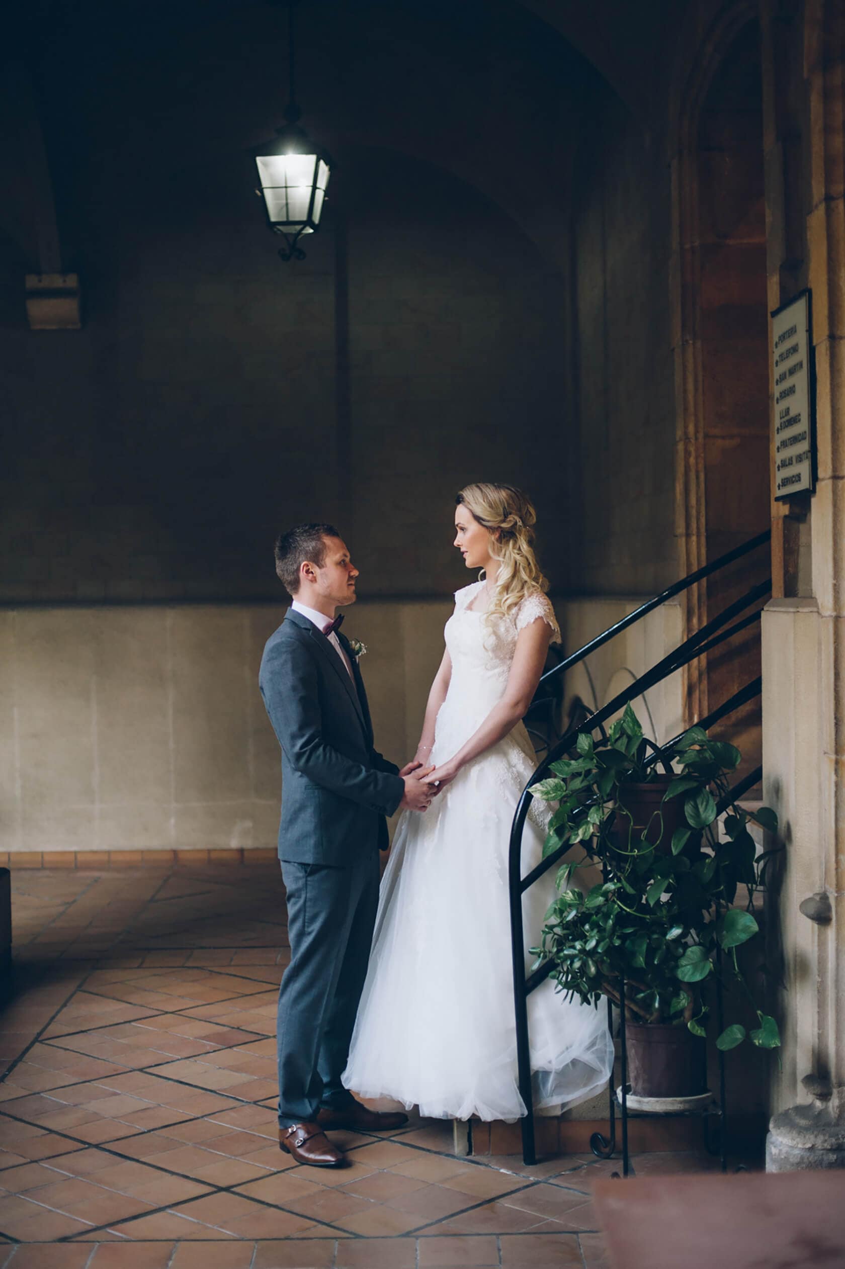 Bride and groom holding hands on stairs, Barcelona wedding photographer - Barcelona Wedding Photographer