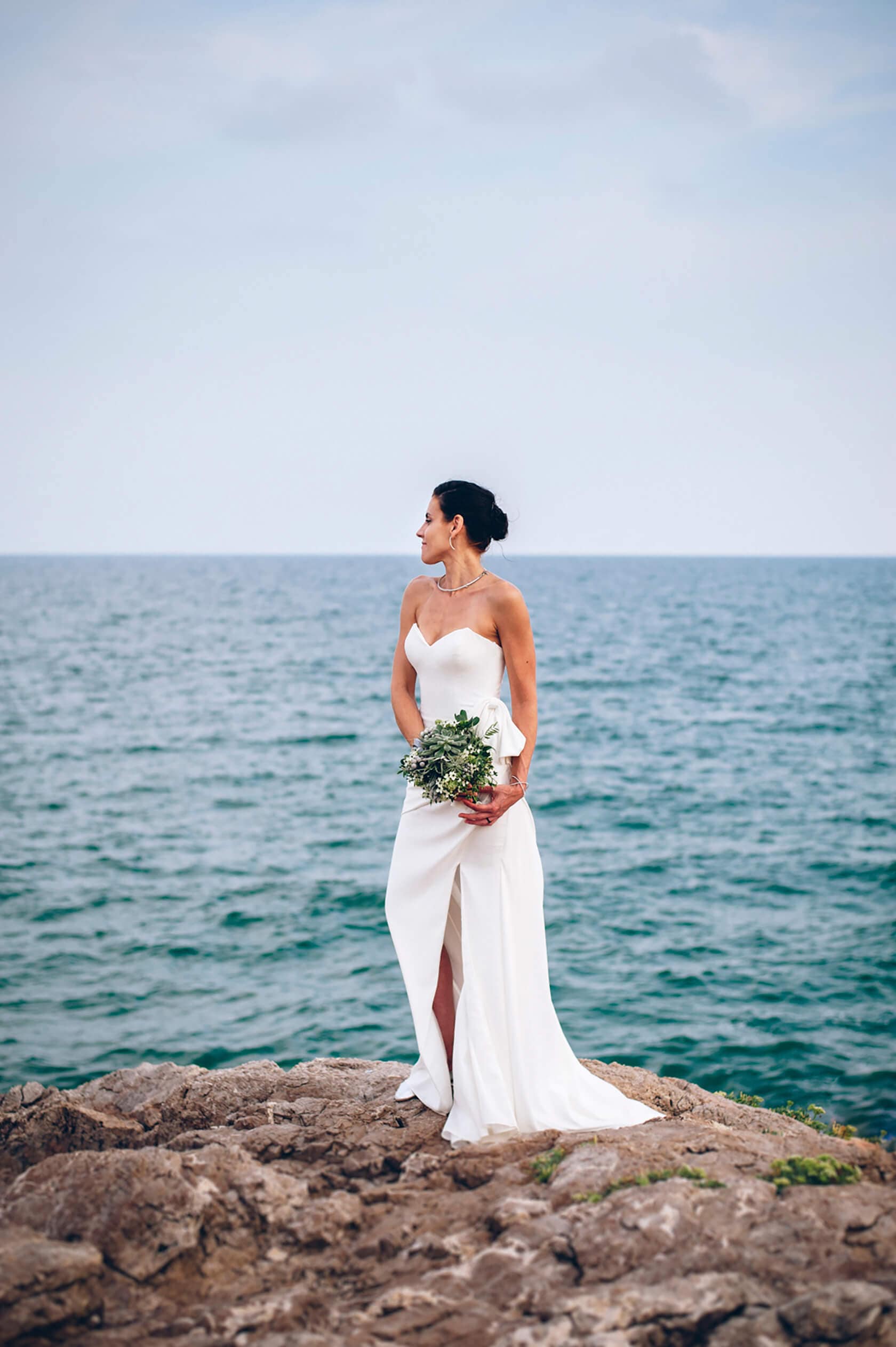 Hayley and Mark, a bride and groom, walk hand-in-hand at their wedding. - Barcelona Wedding Photographer