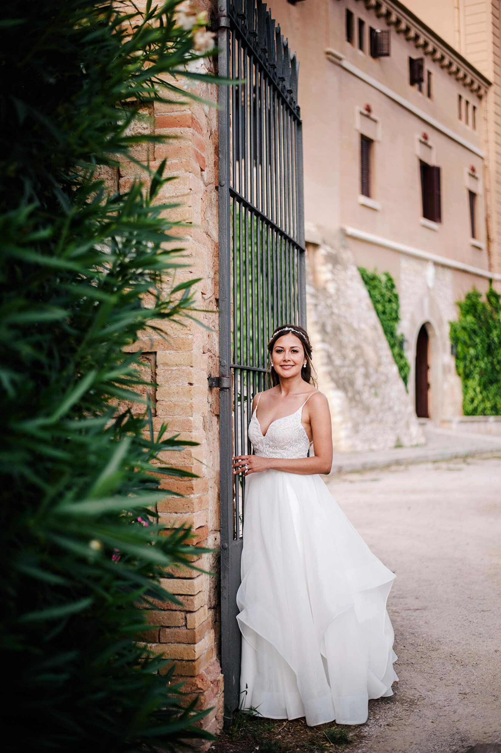 Hayley and Mark, a bride and groom, walk hand-in-hand at their wedding. - Barcelona Wedding Photographer