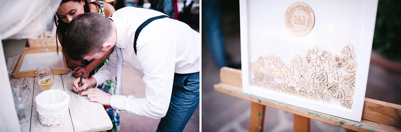 Guests sign a framed guest book at a vintage style wedding. - Barcelona Wedding Photographer
