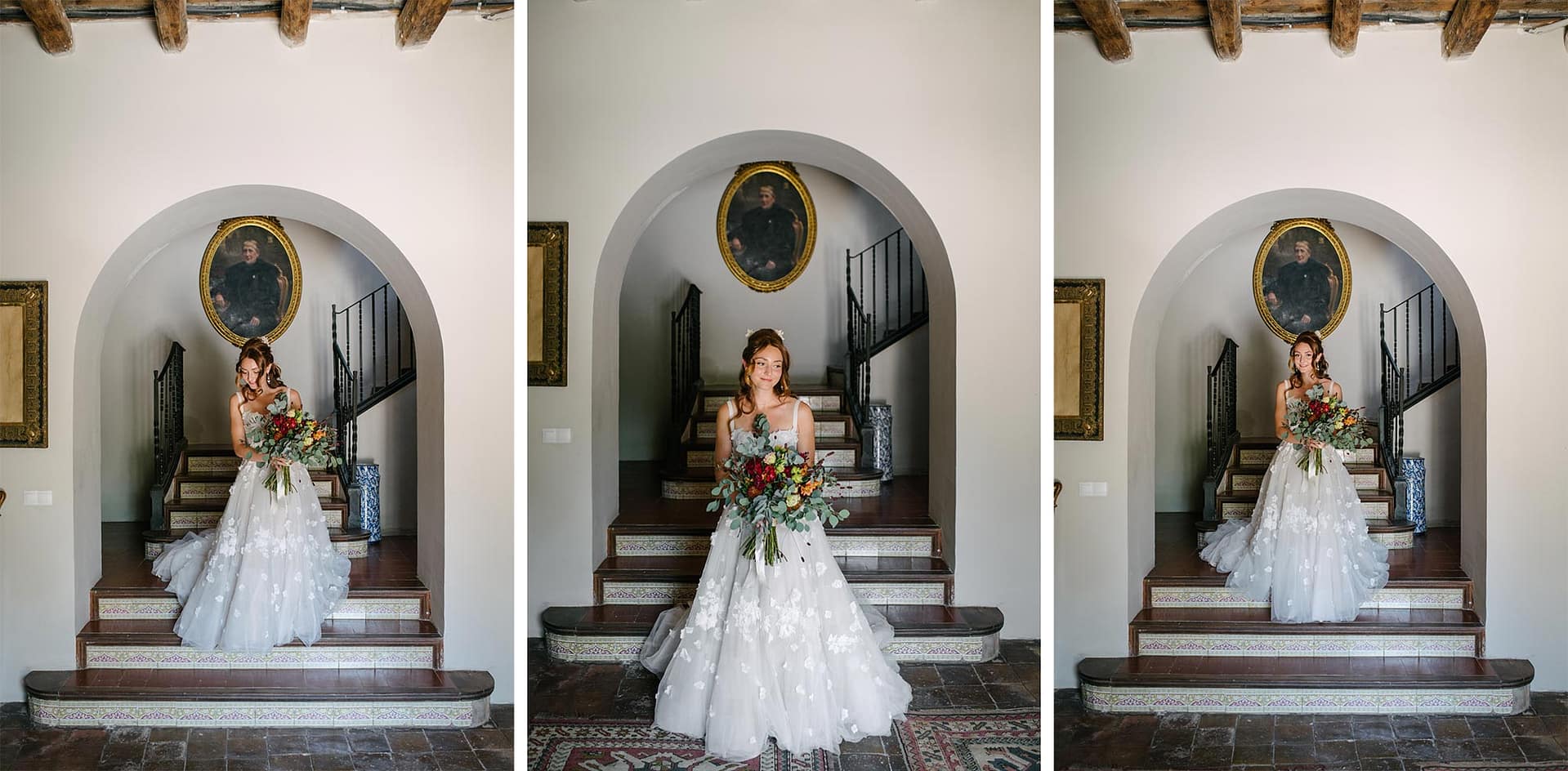 Bride Safia in a white lace gown holding a bouquet on grand stairs - Sitges Wedding Photographer